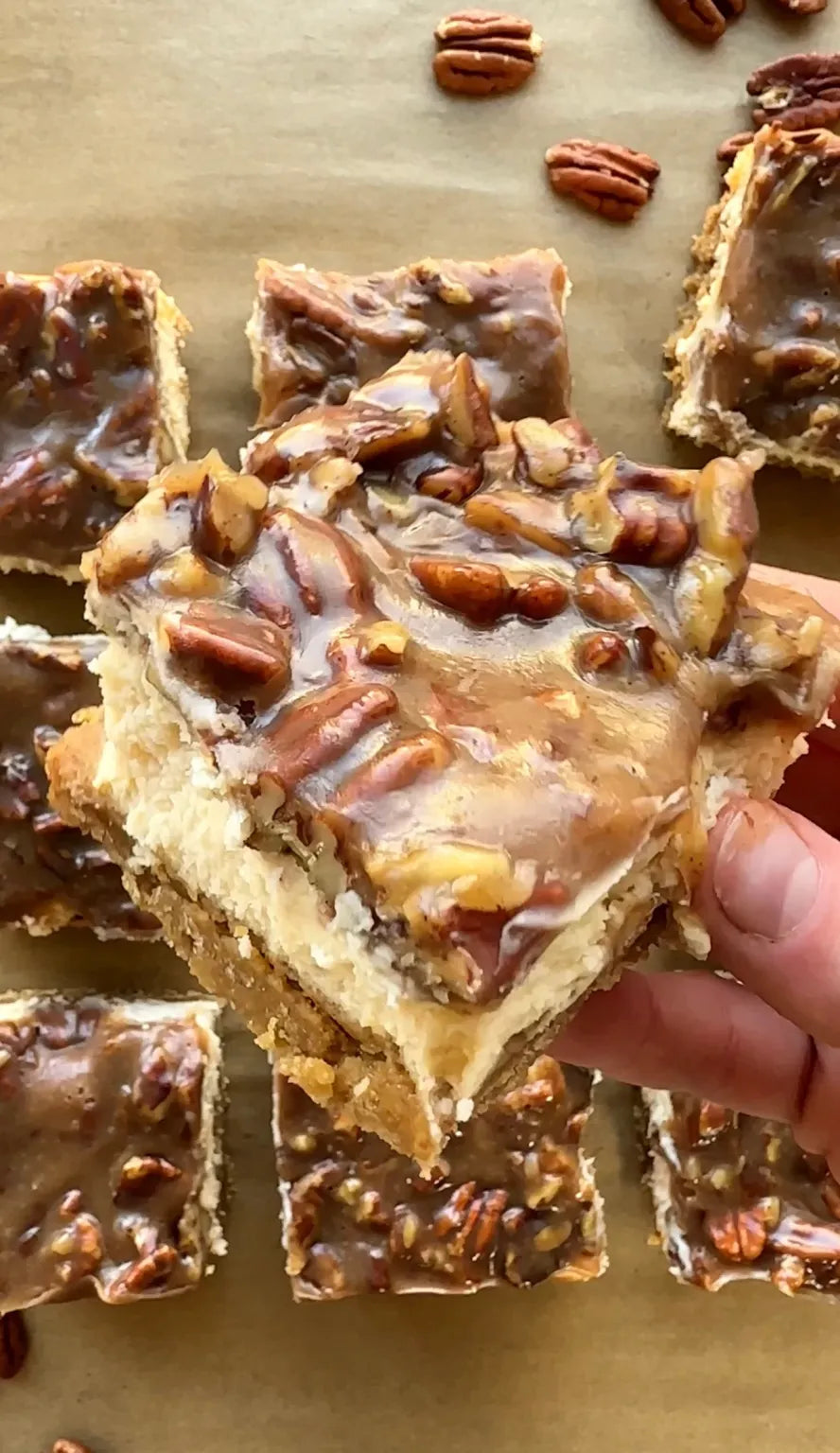 Pecan Pie Cheesecake Bars. Layers of graham cracker crust, cheesecake, topped with pecan pie filling.