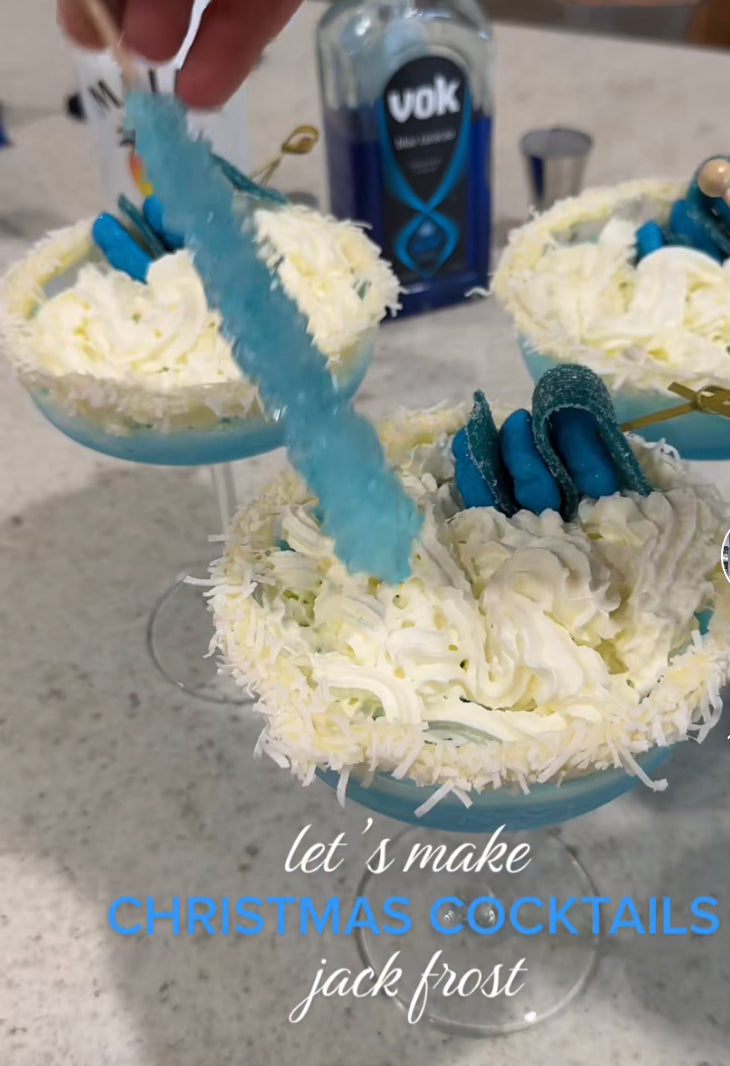 Learn how to make the best Jack Frost Cocktail with vanilla vodka, Malibu rum, Blue Curaçao, coconut cream, and coconut milk. This festive frozen blue cocktail is perfect for Christmas parties, winter celebrations, and holiday entertaining.