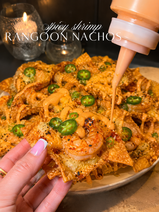 Make the ultimate Spicy Shrimp and Crab Rangoon Nachos with crispy wonton chips, creamy crab filling, juicy shrimp, melty cheese, sweet chili sauce, and spicy mayo. Perfect for parties and game day.